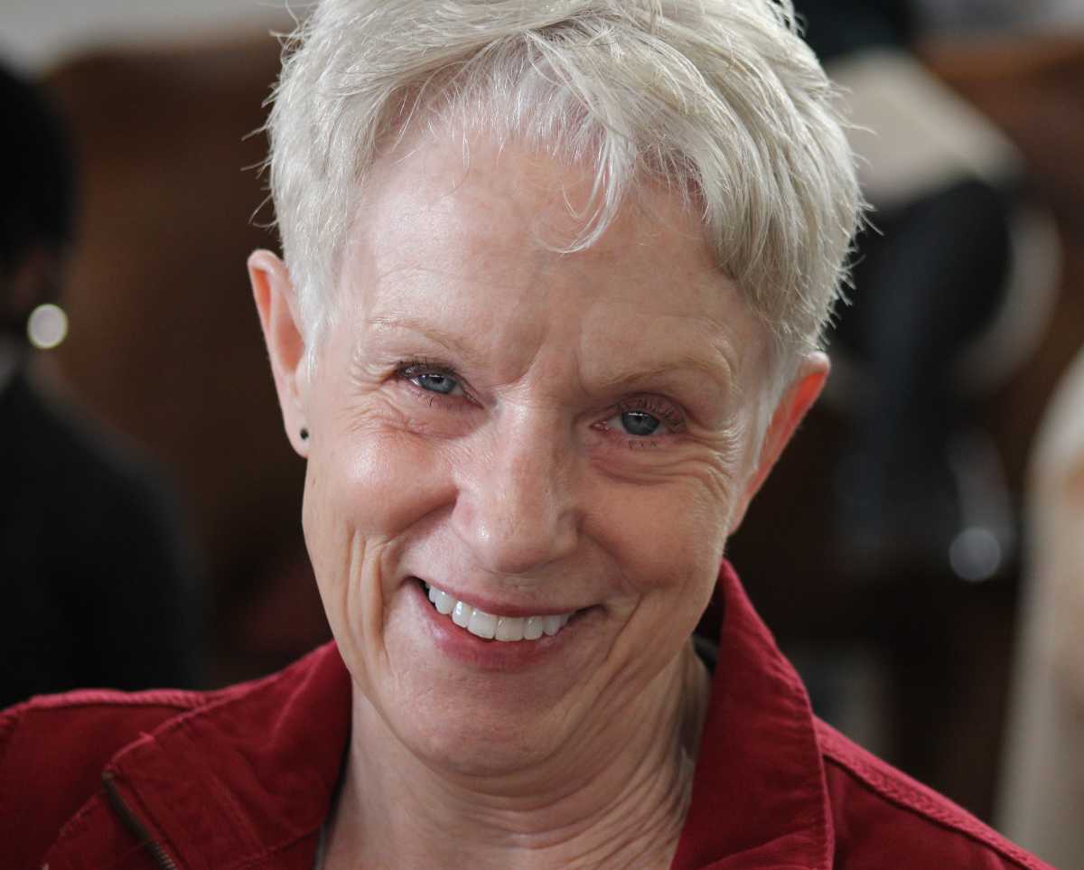 Portrait of Mary Hughes, smiling and looking at the camera.